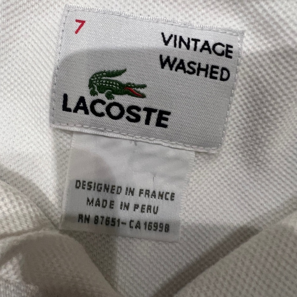 Lacoste Vintage Washed Polo in WhiteLacoste  vintage make a deal on a bundle